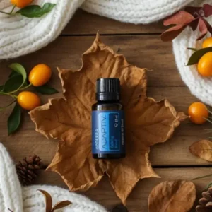 Adaptiv doTERRA na jesiennej dekoracji z liśćmi i szyszkami
