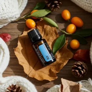 Air doTERRA na jesiennej dekoracji z liśćmi i szyszkami