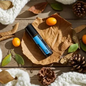 Air Touch doTERRA na jesiennej dekoracji z liśćmi i szyszkami