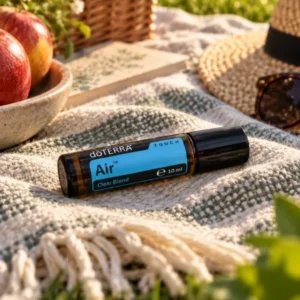 Air Touch doTERRA na jesiennej dekoracji z liśćmi i szyszkami