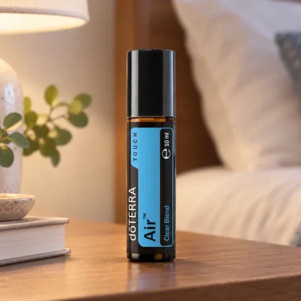 Air Touch doTERRA na drewnianym stoliku nocnym przy łóżku
