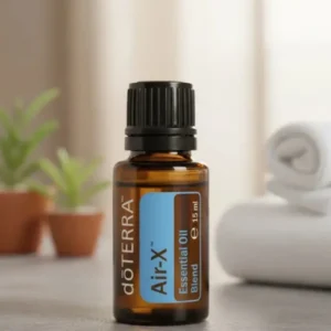 Air-x doTERRA na kamiennej podstawce obok złożonych ręczników spa