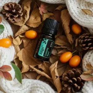 Align doTERRA na jesiennej dekoracji z liśćmi i szyszkami