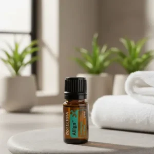 Align doTERRA na kamiennej podstawce obok złożonych ręczników spa