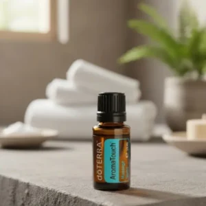 Aromatouch doTERRA na kamiennej podstawce obok złożonych ręczników spa