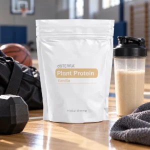 Waniliowe białko roślinne doTERRA i shaker na parkiecie w hali sportowej