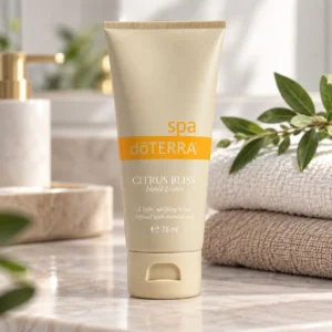 Balsam do rąk Citrus Bliss doTERRA na marmurowym blacie w łazience obok ręczników