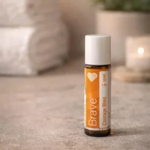 Brave doTERRA na kamiennej podstawce obok złożonych ręczników spa