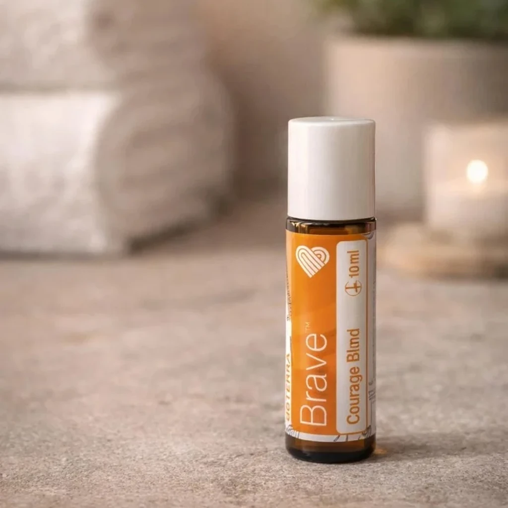 Brave doTERRA na kamiennej podstawce obok złożonych ręczników spa