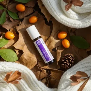 Calmer doTERRA na jesiennej dekoracji z liśćmi i szyszkami