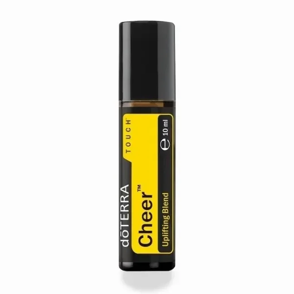 Cheer Touch doTERRA na jesiennej dekoracji z liśćmi i szyszkami