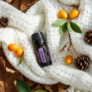 Console doTERRA na jesiennej dekoracji z liśćmi i szyszkami