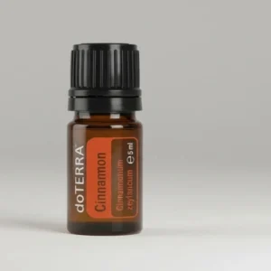 Cynamon doTERRA na szarym tle – ujęcie produktowe