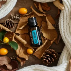 Ddr Prime doTERRA na jesiennej dekoracji z liśćmi i szyszkami