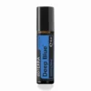 Deep Blue Touch doTERRA na jesiennej dekoracji z liśćmi i szyszkami