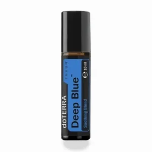 Deep Blue Touch doTERRA na jesiennej dekoracji z liśćmi i szyszkami