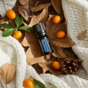Deep Blue doTERRA na jesiennej dekoracji z liśćmi i szyszkami