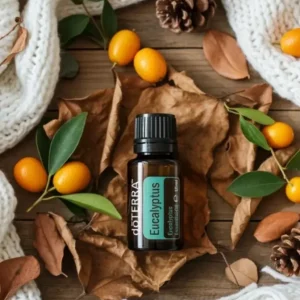 Eukaliptus doTERRA na jesiennej dekoracji z liśćmi i szyszkami