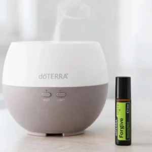 Forgive Touch doTERRA obok dyfuzora aromaterapeutycznego doTERRA