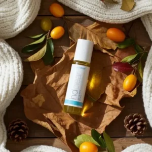 Hd Clear doTERRA na jesiennej dekoracji z liśćmi i szyszkami