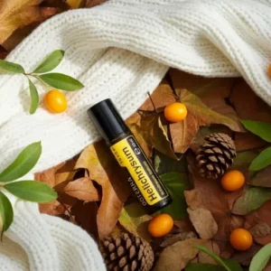 Helichrysum Touch doTERRA na jesiennej dekoracji z liśćmi i szyszkami
