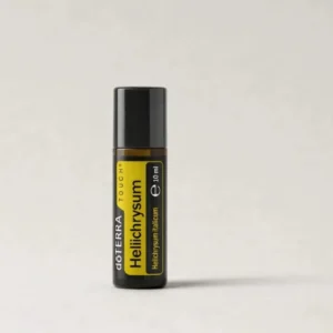 Helichrysum Touch doTERRA na szarym tle – ujęcie produktowe