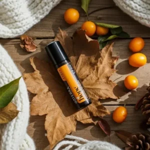 Hope doTERRA na jesiennej dekoracji z liśćmi i szyszkami
