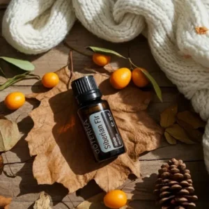 Jodła Syberyjska doTERRA na jesiennej dekoracji z liśćmi i szyszkami
