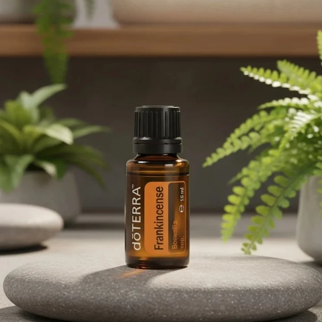 Kadzidło doTERRA na kamiennej podstawce obok złożonych ręczników spa