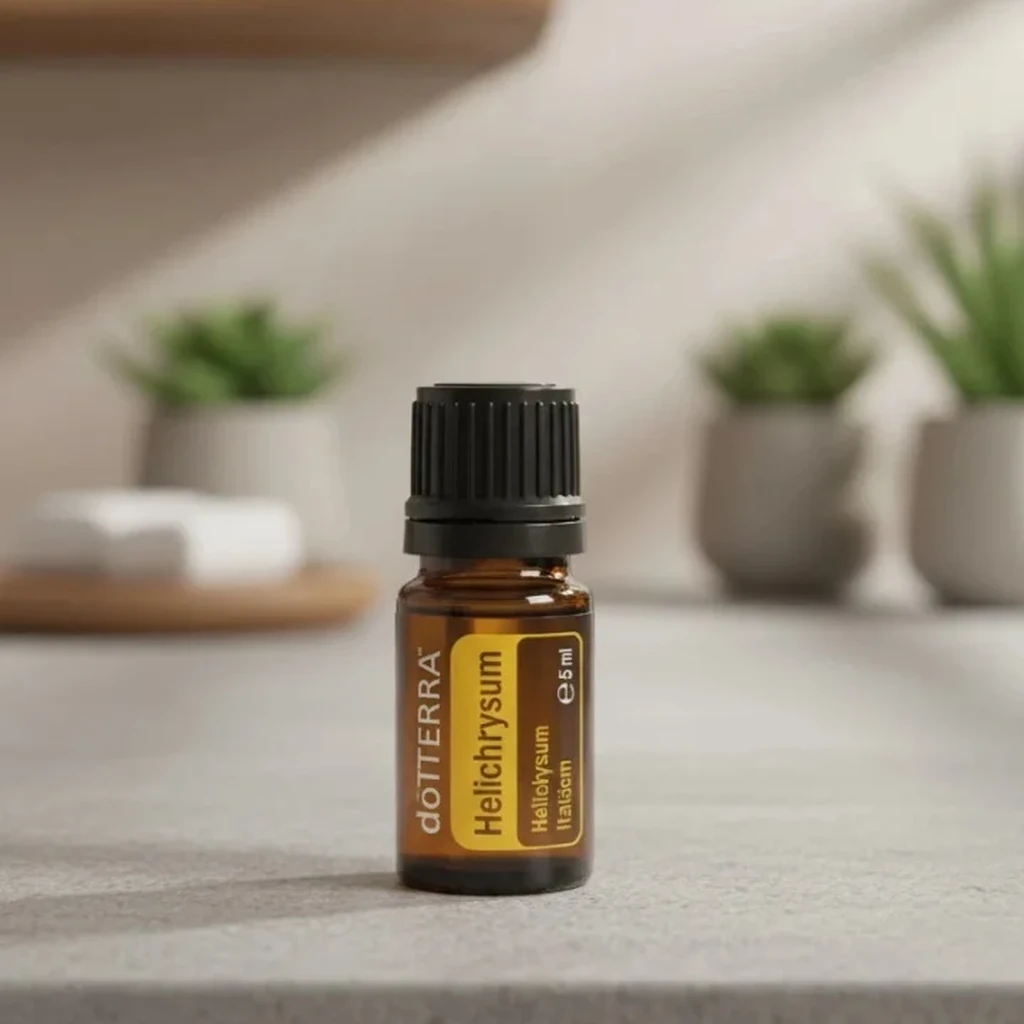 Kocanka Włoska doTERRA na kamiennej podstawce obok złożonych ręczników spa
