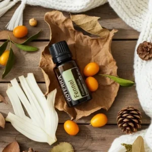 Koper doTERRA na jesiennej dekoracji z liśćmi i szyszkami
