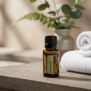 Koper doTERRA na kamiennej podstawce obok złożonych ręczników spa