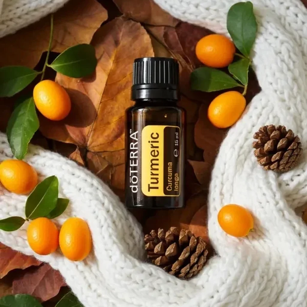 Kurkuma doTERRA na jesiennej dekoracji z liśćmi i szyszkami