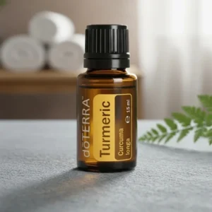 Kurkuma doTERRA na kamiennej podstawce obok złożonych ręczników spa