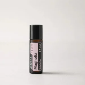 Magnolia Touch doTERRA na szarym tle – ujęcie produktowe