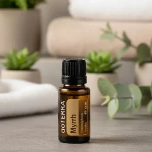 Mirra doTERRA na kamiennej podstawce obok złożonych ręczników spa