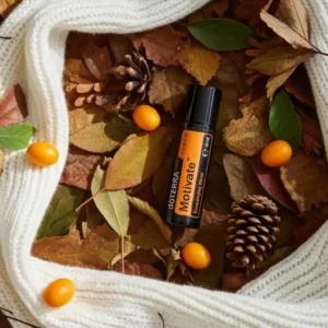 Motivate Touch doTERRA na jesiennej dekoracji z liśćmi i szyszkami