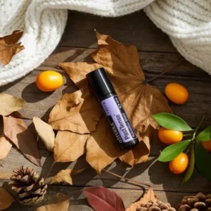 Pasttense doTERRA na jesiennej dekoracji z liśćmi i szyszkami