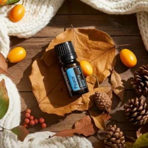 Peace doTERRA na jesiennej dekoracji z liśćmi i szyszkami