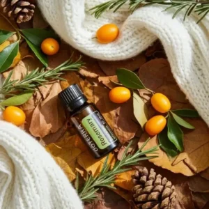 Rozmaryn doTERRA na jesiennej dekoracji z liśćmi i szyszkami