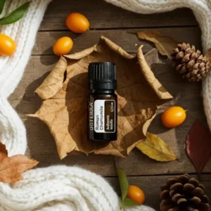 Rumianek Rzymski doTERRA na jesiennej dekoracji z liśćmi i szyszkami