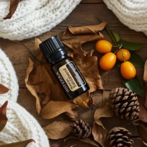 Sandałowiec Hawajski doTERRA na jesiennej dekoracji z liśćmi i szyszkami