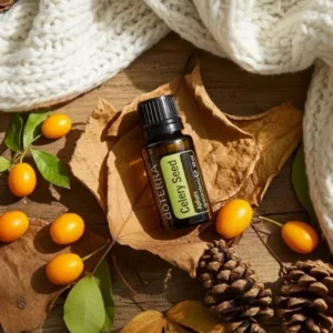 Seler (nasiona) doTERRA na jesiennej dekoracji z liśćmi i szyszkami