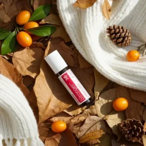 Stronger doTERRA na jesiennej dekoracji z liśćmi i szyszkami