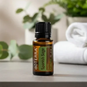 Szałwia Lawendolistna doTERRA na kamiennej podstawce obok złożonych ręczników spa