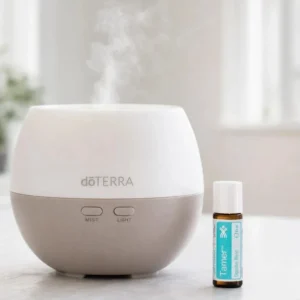 Tamer doTERRA obok dyfuzora aromaterapeutycznego doTERRA
