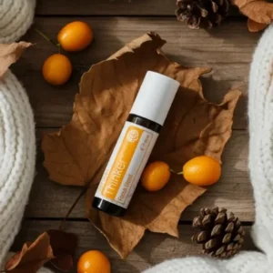 Thinker doTERRA na jesiennej dekoracji z liśćmi i szyszkami