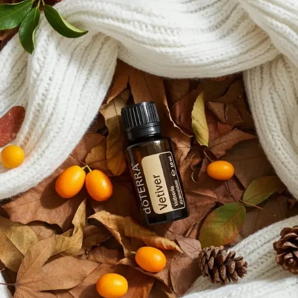 Wetiweria doTERRA na jesiennej dekoracji z liśćmi i szyszkami