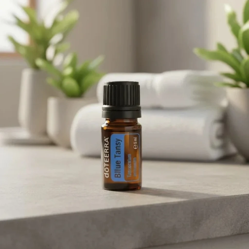 Wrotycz Marokański doTERRA na kamiennej podstawce obok złożonych ręczników spa